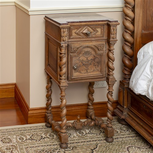 18 · AN ANTIQUE CARVED TIMBER BEDSIDE TABLE