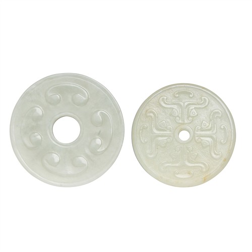22 · TWO CHINESE WHITE JADE ROUNDED PENDENT, QING DYNASTY (1644 - 1911)