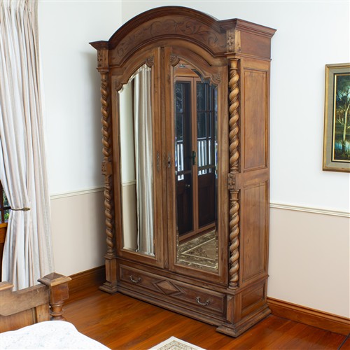 16 · A LARGE ANTIQUE TIMBER WARDROBE