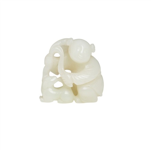 A CHINESE WHIE JADE CARVING OF A BOY AND A DOG, QING DYNASTY (1644 - 1911)