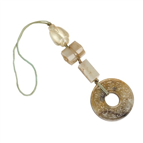 45 · A GROUP OF FOUR CHINESE ARCHAIC JADE PENDANTS