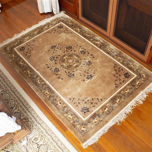 A SMALL CHINESE SILK RUG