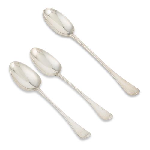 64 · THREE GEORGE II STERLING SILVER GRAVY SPOONS