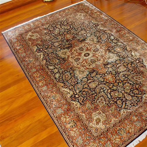 AN ORNATE SILK RUG FROM CASHMERE