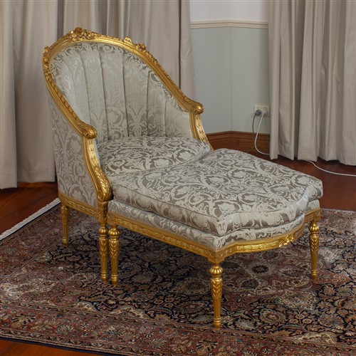 5 · A FRENCH BERGERE CHAIR WITH MATCHED FOOTSTOOL