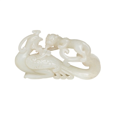 A CHINESE WHITE JADE CARVING OF A PHOENIX AND A MYTHICAL BEAST, QING DYNASTY (1644 - 1911)