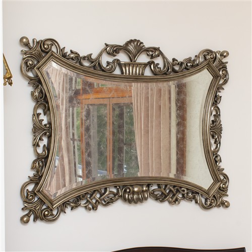 22 · AN ORNATE MIRROR IN THE ANTIQUE TASTE