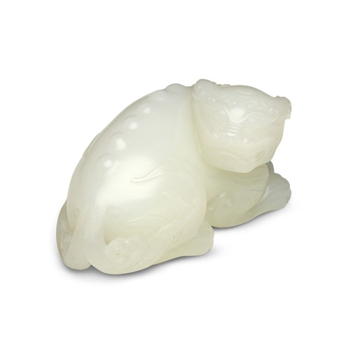 69 · A FINE CHINESE WHITE JADE RECUMBENT MYTHICAL BEAST, MID-QING DYNASTY, 18TH CENTURY