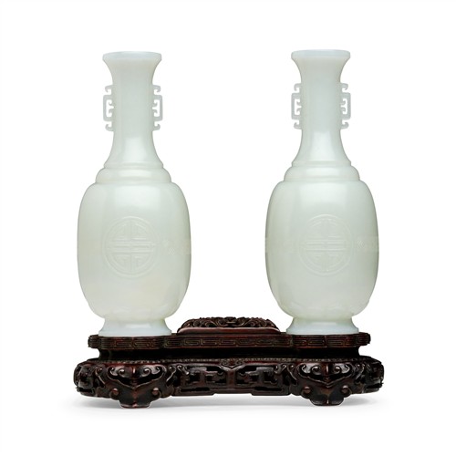 83 · A PAIR OF FINELY CARVED CHINESE WHITE JADE VASES, QING DYNASTY (1644-1912)