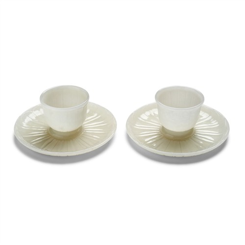 80 · A VERY FINE PAIR OF CHINESE WHITE JADE CUPS AND STANDS, QIANLONG MARK AND OF THE PERIOD (1736-1795)