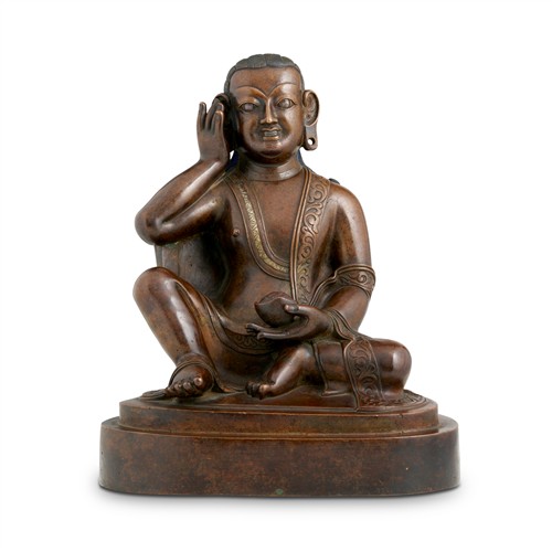 71 · A LARGE AND FINE TIBETAN BRONZE AND SILVER INLAID SEATED YOGI, 18TH CENTURY