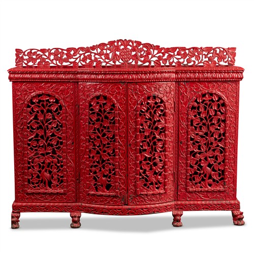 5 · AN INDIAN CARVED HARDWOOD SIDE CABINET, LATER PAINTED RED Late 19th century Please see important information below regarding collect...