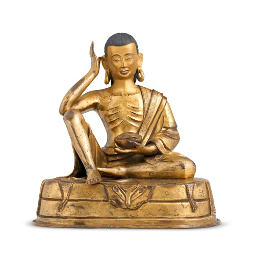69 · A TIBETAN GILT-BRONZE SEATED FIGURE OF LAMA, KANGXI SEVEN-CHARACTER INSCRIBED MARK, 17TH/18TH CENTURY