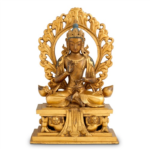 55 · A SINO-TIBETAN GILT BRONZE SEATED FIGURE OF A BUDDHA, 18TH CENTURY