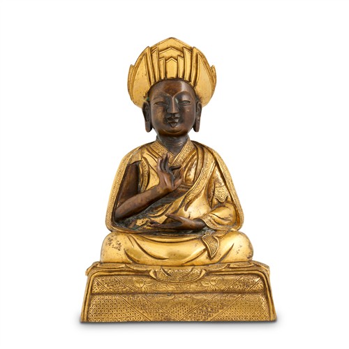 67 · A TIBETAN GILT BRONZE SEATED LAMA, 18TH CENTURY