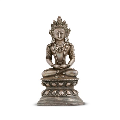 54 · A TIBETAN SILVER SEATED FIGURE OF BUDDHA, 18TH/19TH CENTURY