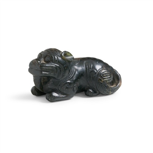 A Small Chinese Green And Russet Jade Guardian Lion, Ming Dynasty (1368 - 1644)