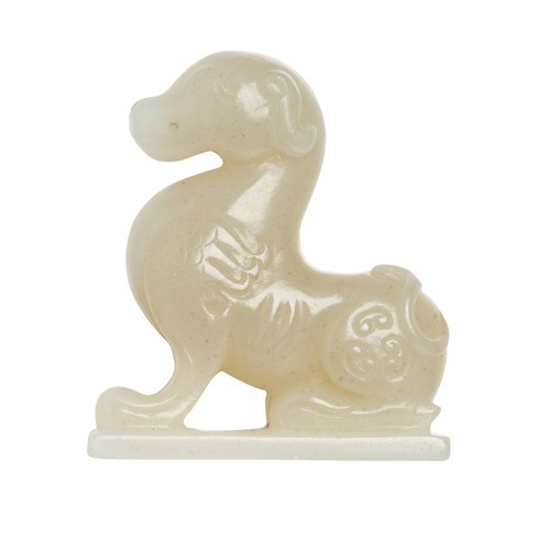 36 · A CHINESE WHITE JADE CARVED DOG