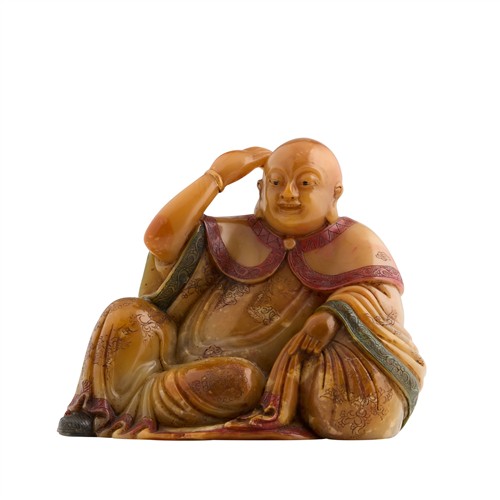 1100 · A CHINESE SOAPSTONE SEATED FIGURE OF A MONK