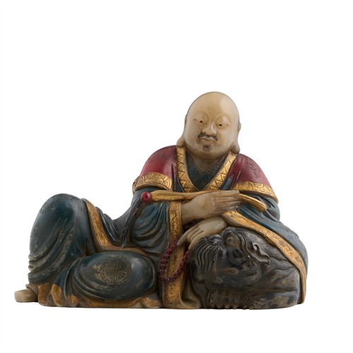 1099 · A CHINESE SOAPSTONE FIGURE OF A MONK