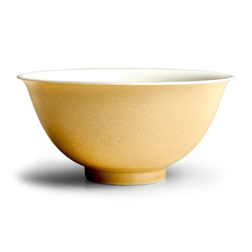 15 · A FINE AND RARE CHINESE YELLOW-GLAZED INCISED "DRAGON AND PHOENIX" ANHUA BOWL, YONGZHENG SIX-CHARACTER MARK IN UNDERGLAZE BLUE WITHI...