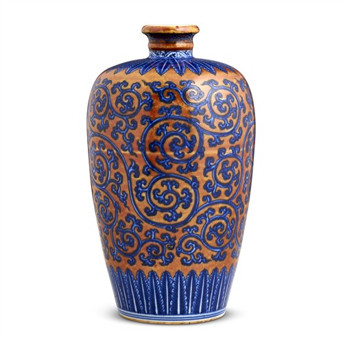 A CHINESE BLUE AND WHITE 'PRUNUS' AND RED GROUND MEIPING VASE